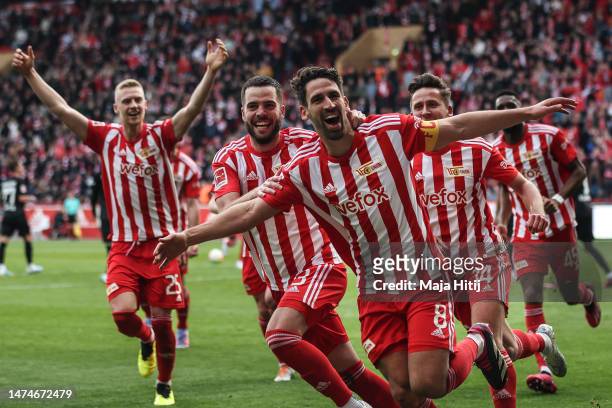 Rani Khedira of 1. FC Union Berlin celebrates with teammates after scoring their team's first goal during the Bundesliga match between 1. FC Union...