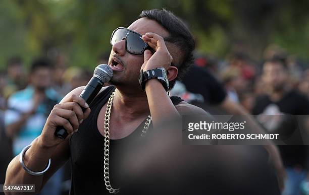 Popular local singer Honey Singh performs during a motorcycle street show near India Gate in New Delhi on June 30, 2012. Three of the top ten Extreme...