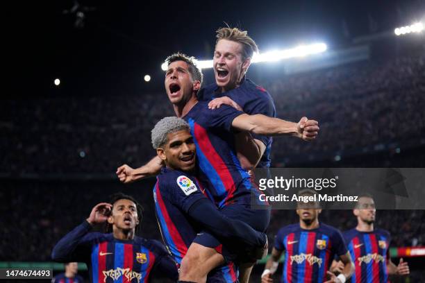 Sergi Roberto of FC Barcelona celebrates with his teammates Ronald Araujo and Frenkie de Jong after scoring the team’s first goal during the LaLiga...