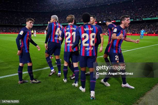 Sergi Roberto of FC Barcelona celebrates after scoring the team's first goal with team mates during the LaLiga Santander match between FC Barcelona...