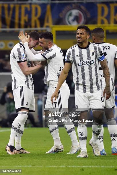 Filip Kostic of Juventus celebrates his first goal with his teammate Dusan Vlahovic during the Serie A match between FC Internazionale and Juventus...