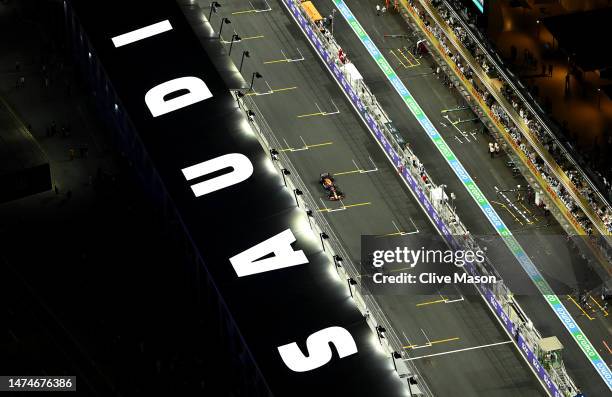 Fernando Alonso of Spain driving the Aston Martin AMR23 Mercedes leads Sergio Perez of Mexico driving the Oracle Red Bull Racing RB19 on track during...