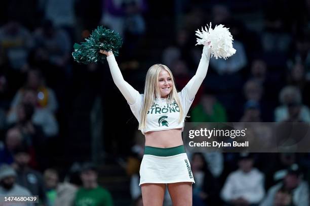 Michigan State Spartans cheerleader performs prior to the second round game against the Marquette Golden Eagles in the NCAA Men's Basketball...