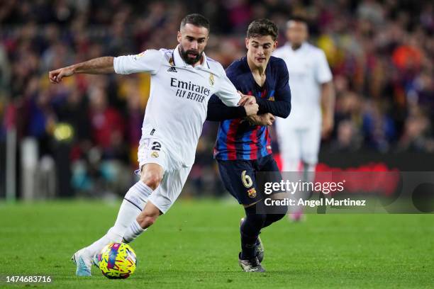 Daniel Carvajal of Real Madrid battles for possession with Gavi of FC Barcelona during the LaLiga Santander match between FC Barcelona and Real...