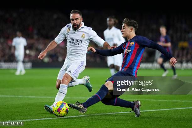 Gavi of FC Barcelona battles for possession with Daniel Carvajal of Real Madrid during the LaLiga Santander match between FC Barcelona and Real...