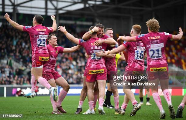 Exeter Chiefs celebrate victory after the Premiership Rugby Cup match between London Irish and Exeter Chiefs at Gtech Community Stadium on March 19,...