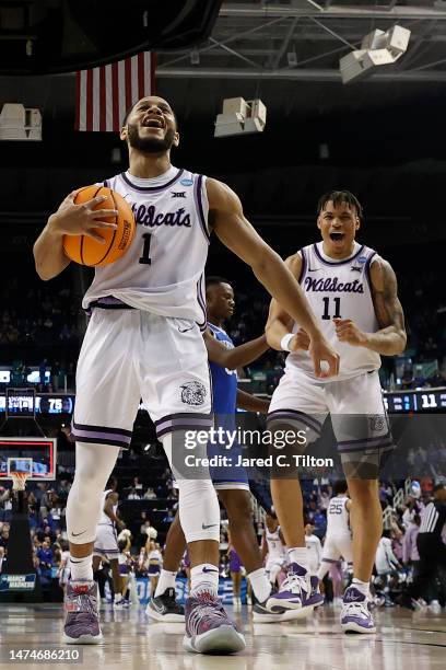 Markquis Nowell and Keyontae Johnson of the Kansas State Wildcats celebrate after defeating the Kentucky Wildcats 75-69 in the second round of the...