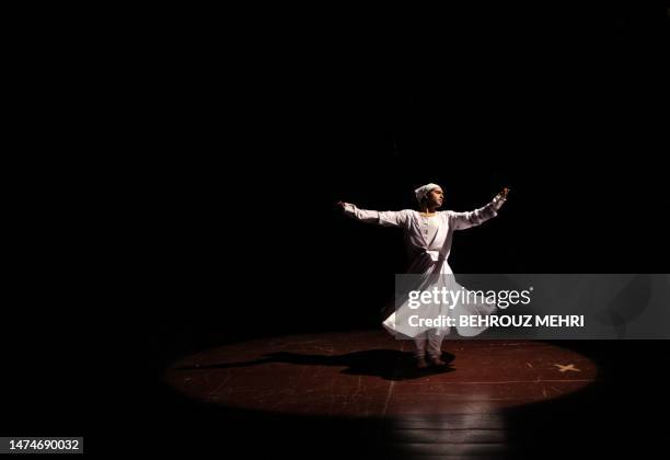 Pakistani dancer Adnan Jahangir performs during a Sufi dance during a performance organised by the the Acid Survivors Foundation NGO in Islamabad on...