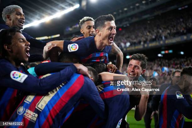 Franck Kessie of FC Barcelona celebrates with Robert Lewandowski and team mates after scoring the team's second goal during the LaLiga Santander...