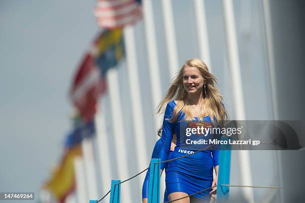 Grid girl smiles on the podium at the end of the MotoGP race of the MotoGp Of Holland at TT Circuit Assen on June 30, 2012 in Assen, Netherlands.