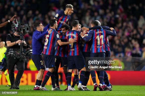 Players of FC Barcelona celebrate victory in the LaLiga Santander match between FC Barcelona and Real Madrid CF at Spotify Camp Nou on March 19, 2023...