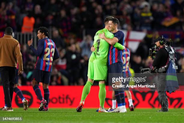 Marc-Andre ter Stegen and Robert Lewandowski of FC Barcelona hug after their victory in the LaLiga Santander match between FC Barcelona and Real...