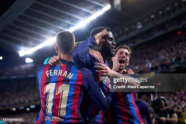 Franck Kessie of FC Barcelona celebrates with Ferran Torres and Sergi Roberto of FC Barcelona after scoring the team's second goal during the LaLiga...