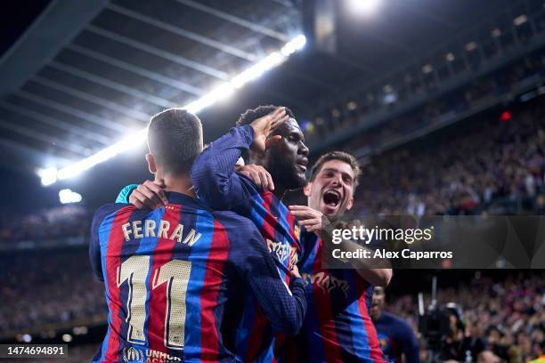 Franck Kessie of FC Barcelona celebrates with Robert Lewandowski and team mates after scoring the team's second goal during the LaLiga Santander...