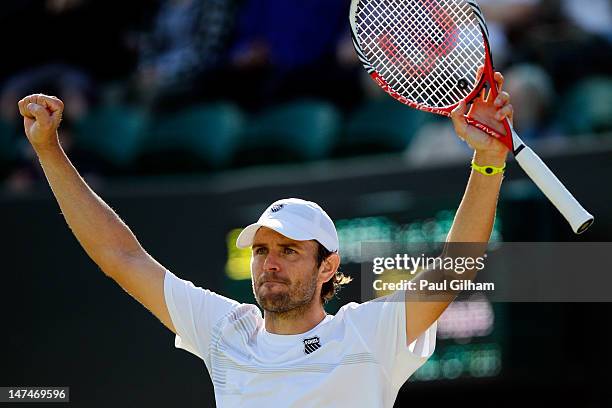 Mardy Fish of the USA celebrates after winning his Gentlemen's Singles third round match against David Goffin of Belgium on day six of the Wimbledon...