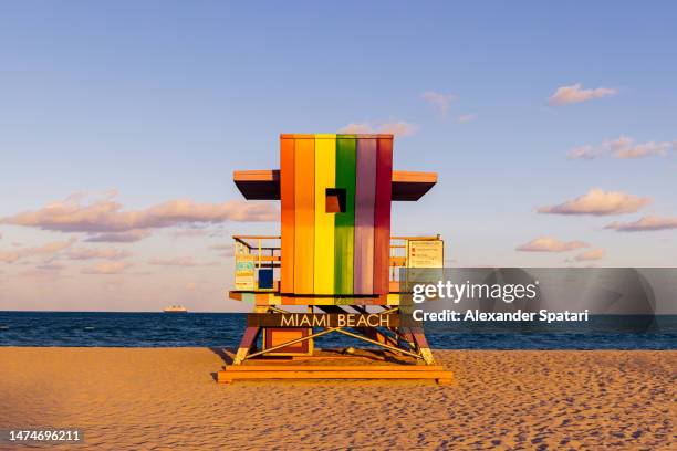 rainbow colored lifeguard tower in miami beach, florida, usa - miami florida stock pictures, royalty-free photos & images