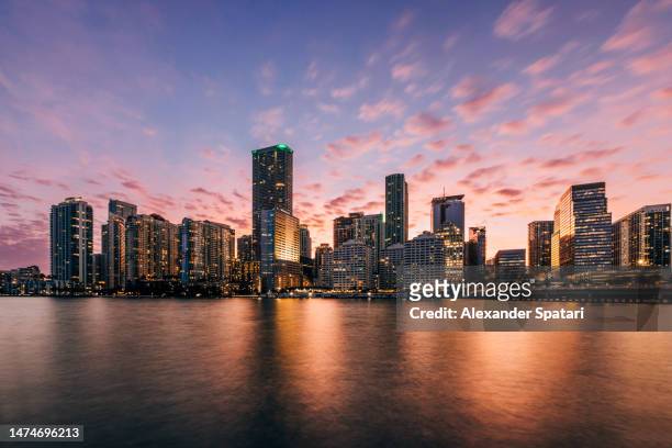 miami downtown skyscrapers illuminated at sunset, florida, usa - miami stock pictures, royalty-free photos & images