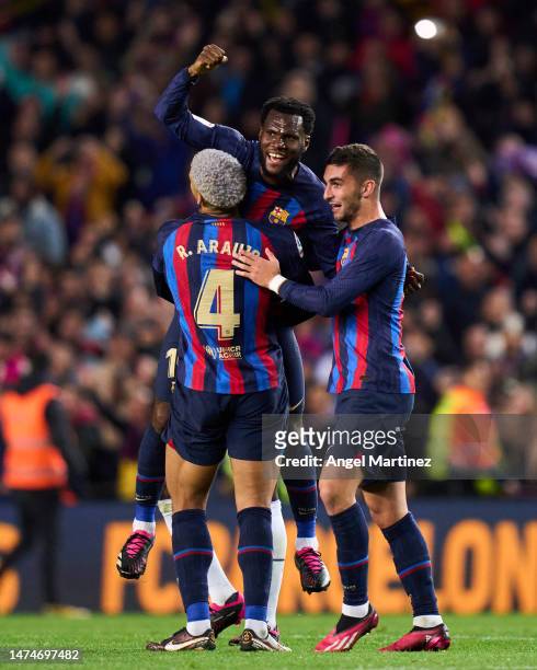 Franck Kessie, Ronald Araujo and Ferran Torres of FC Barcelona hug after their victory in the LaLiga Santander during the LaLiga Santander match...