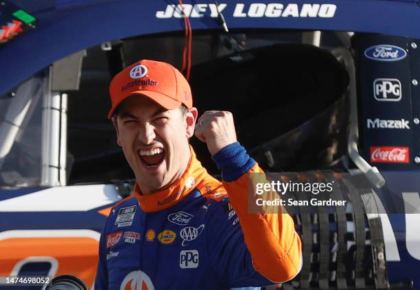 Joey Logano, driver of the Autotrader Ford, celebrates after winning the NASCAR Cup Series Ambetter Health 400 at Atlanta Motor Speedway on March 19,...