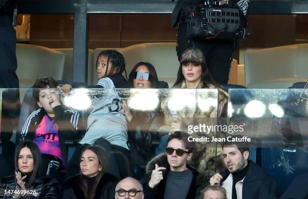 Kim Kardashian holding her son Saint West, Kendall Jenner attend the Ligue 1 Uber Eats match between Paris Saint-Germain and Stade Rennais at Parc...