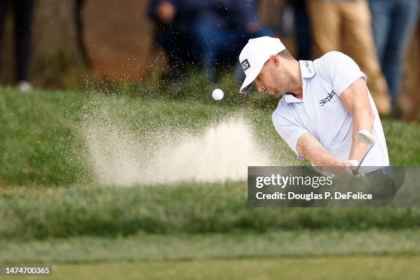 Taylor Moore of the United States plays a shot from a bunker on the 17th hole during the final round of the Valspar Championship at Innisbrook Resort...