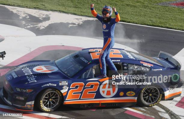 Joey Logano, driver of the Autotrader Ford, celebrates after winning the NASCAR Cup Series Ambetter Health 400 at Atlanta Motor Speedway on March 19,...