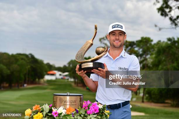 Taylor Moore of the United States celebrates with the trophy after winning during the final round of the Valspar Championship at Innisbrook Resort...