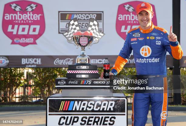 Joey Logano, driver of the Autotrader Ford, celebrates in victory lane after winning the NASCAR Cup Series Ambetter Health 400 at Atlanta Motor...