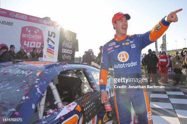 Joey Logano, driver of the Autotrader Ford, celebrates in victory lane after winning the NASCAR Cup Series Ambetter Health 400 at Atlanta Motor...