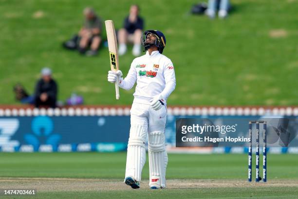 Dhananjaya De Silva of Sri Lanka celebrates his half century during day four of the Second Test Match between New Zealand and Sri Lanka at Basin...