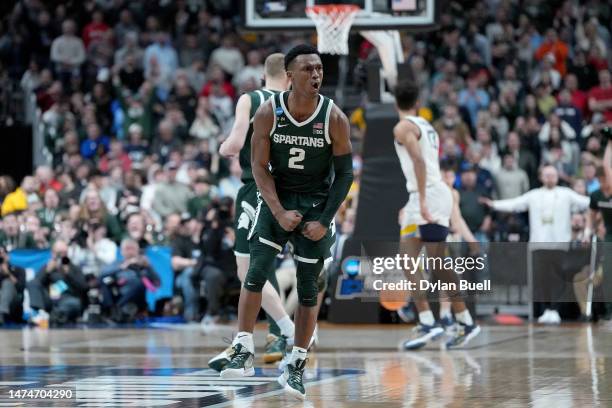 Tyson Walker of the Michigan State Spartans celebrates a basket against the Marquette Golden Eagles during the second half in the second round game...