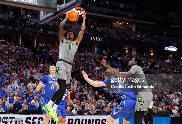 Jalen Bridges of the Baylor Bears dunks during the first half against the Creighton Bluejays in the second round of the NCAA Men's Basketball...