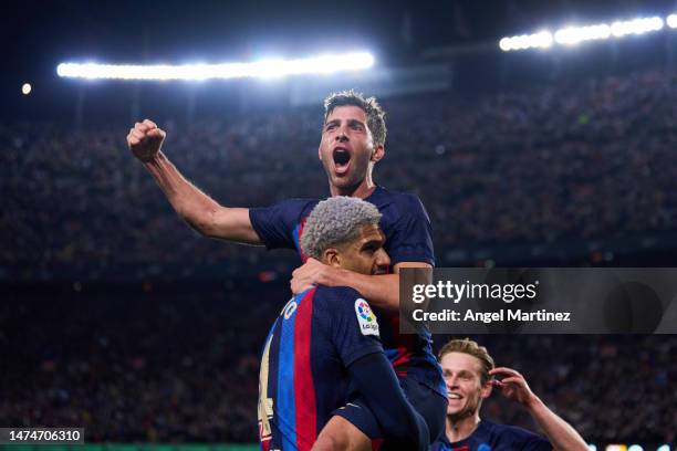 Sergi Roberto of FC Barcelona celebrates with his teammate Ronald Araujo of FC Barcelona after scoring the team’s first goal during the LaLiga...
