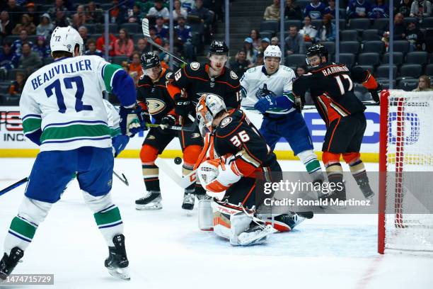 John Gibson of the Anaheim Ducks makes a save against the Vancouver Canucks in the first period at Honda Center on March 19, 2023 in Anaheim,...