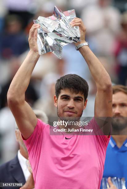 Carlos Alcaraz of Spain with the winners trophy after defeating Daniil Medvedev in the final during the BNP Paribas Open on March 19, 2023 in Indian...