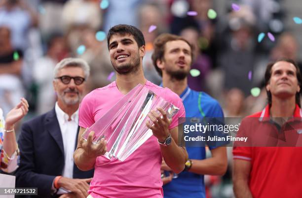 Carlos Alcaraz of Spain with the winners trophy after defeating Daniil Medvedev in the final during the BNP Paribas Open on March 19, 2023 in Indian...