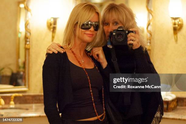Actress Nicollette Sheridan of "Desperate Housewives" on ABC poses for a photo in the mirror at the Beverly Hills Hotel with photographer Roxanne...