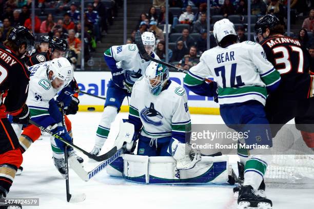 Collin Delia of the Vancouver Canucks makes a save against the Anaheim Ducks in the second period at Honda Center on March 19, 2023 in Anaheim,...