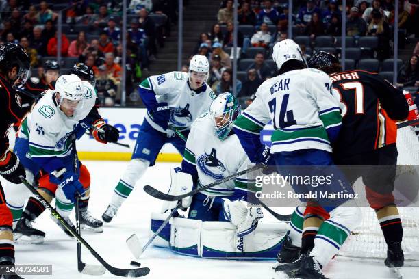 Collin Delia of the Vancouver Canucks makes a save against the Anaheim Ducks in the second period at Honda Center on March 19, 2023 in Anaheim,...