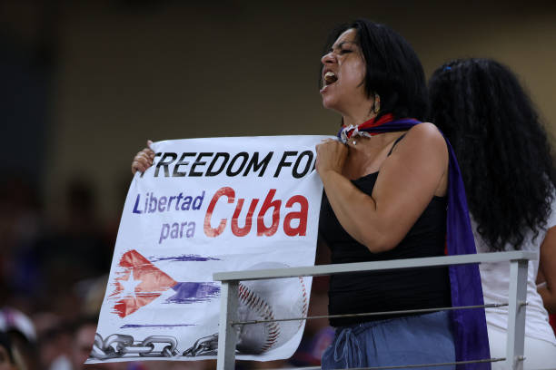 Fan holds a sign during the World Baseball Classic Semifinals between Team Cuba and Team USA at loanDepot park on March 19, 2023 in Miami, Florida.