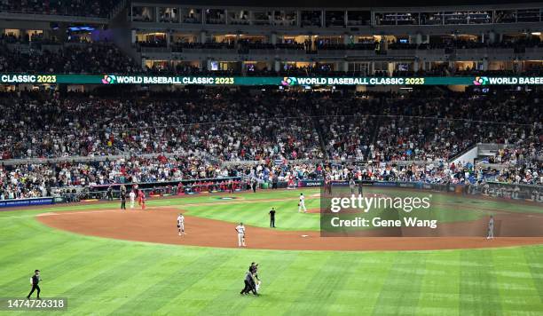 Protestor runs on to the field at loanDepot park and waving flag during the World Baseball Classic Semifinals between Cuba and United States at...