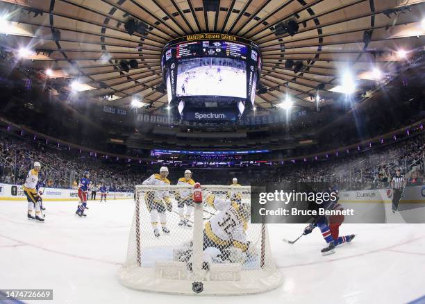 Mika Zibanejad of the New York Rangers scores a first period goal against Kevin Lankinen of the Nashville Predators at Madison Square Garden on March...