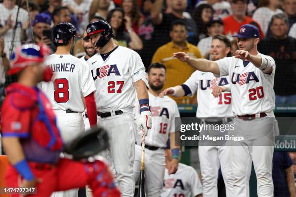 Trea Turner of Team USA celebrates with teammates after hitting a three-run home run in the sixth inning against Team Cuba during the World Baseball...