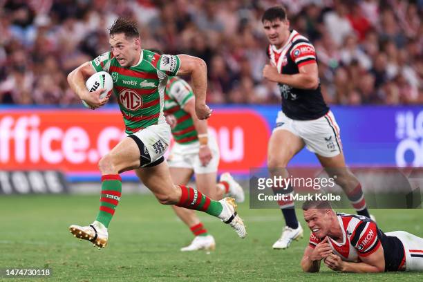 Cameron Murray of the Rabbitohs breaks the tackle of Lindsay Collins of the Roosters during the round three NRL match between Sydney Roosters and...
