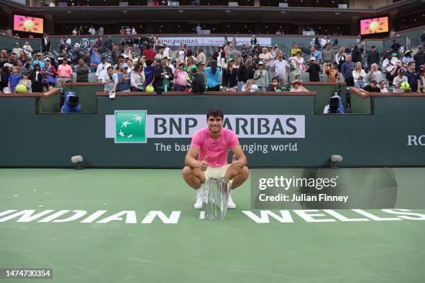 Carlos Alcaraz of Spain with the winners trophy after defeating Daniil Medvedev in the final during the BNP Paribas Open on March 19, 2023 in Indian...