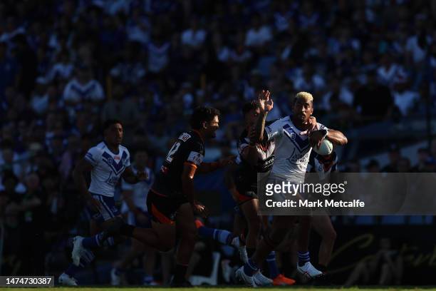 Viliame Kikau of the Bulldogs is tackled during the round three NRL match between Canterbury Bulldogs and Wests Tigers at Belmore Sports Ground on...
