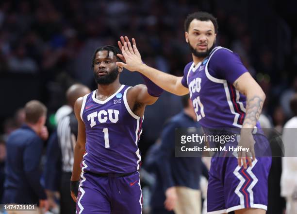Mike Miles Jr. #1 and JaKobe Coles of the TCU Horned Frogs react after the conclusion of the first half against the Gonzaga Bulldogs in the second...