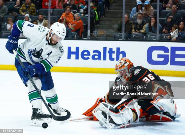 Miller of the Vancouver Canucks skates the puck against John Gibson of the Anaheim Ducks in the third period at Honda Center on March 19, 2023 in...