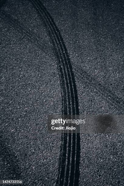 racing track covered with tire marks - asphalt stock pictures, royalty-free photos & images
