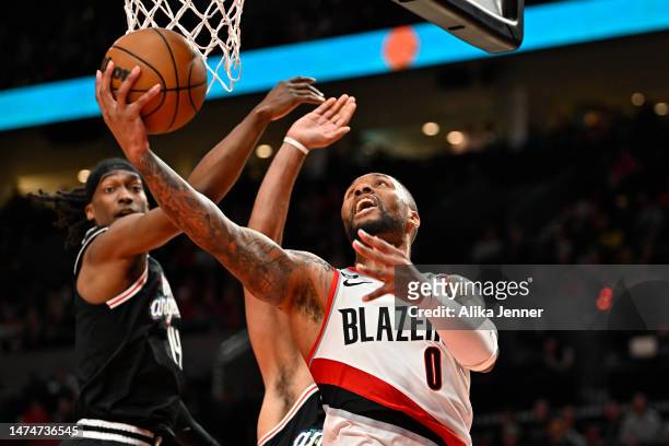Damian Lillard of the Portland Trail Blazers drives to the basket during the third quarter against the LA Clippers at the Moda Center on March 19,...